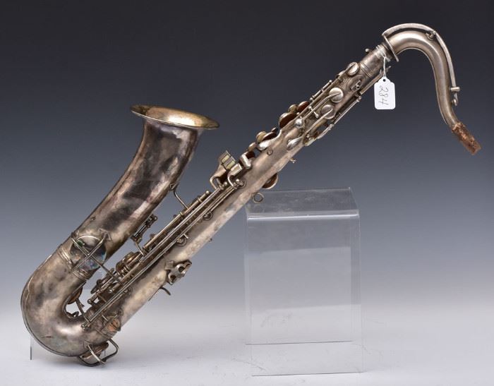 CG Conn Saxophone
with silver finish
28" long, with hard case