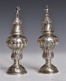 .800 German Silver Cellars
with figural putti finials
each engraved with swag, flowers
and putti, 7 1/2" high
11.4 troy ounces
