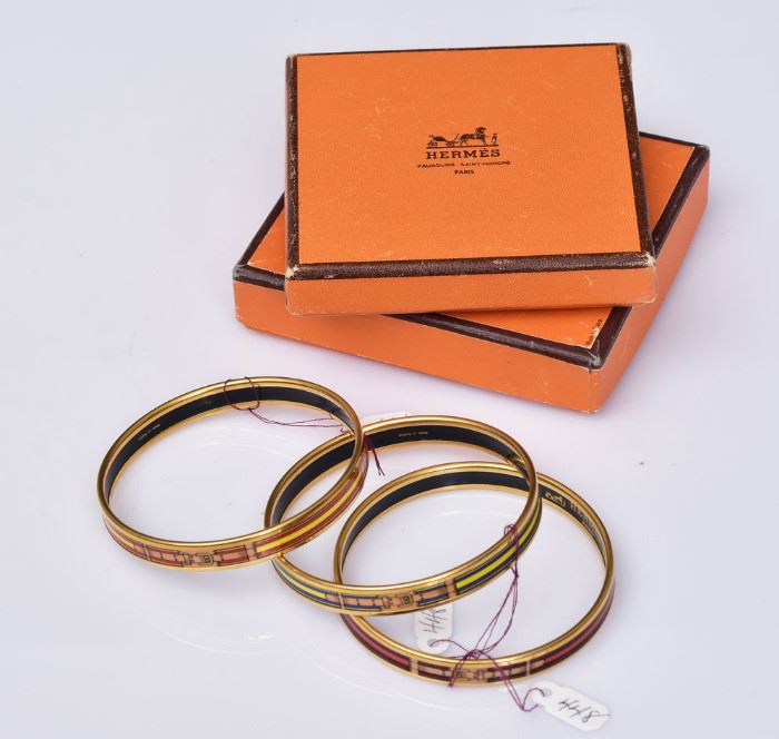 Hermes Enameled Cuff Bracelets (3)
with buckle design
9" cuff, all signed "Hermes/Paris/
Made in Austria", in a Hermes box