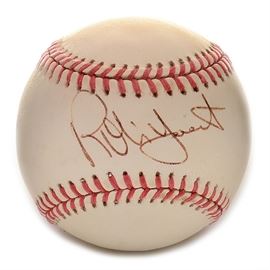 Robin Yount Signed Rawlings AL Baseball SGC COA: A (HOF) Robin Yount signed Rawlings American League (Brown Pres.) baseball. Robin signed this baseball on the “sweet spot” area in black ink pen. The autograph is bold and smudge free and has been professionally authenticated by SGC with hologram affixed to the baseball. Please note, there is an accompanying SGC certification card enclosed. A member of the National Baseball Hall Of Fame, Robin is a member of Major League Baseball’s “3000 Hit Club.” A three-time American League All-Star and two-time “Most Valuable Player,” Robin was elected to the Hall Of Fame in 1999. The signed baseball is housed in a protective holder.