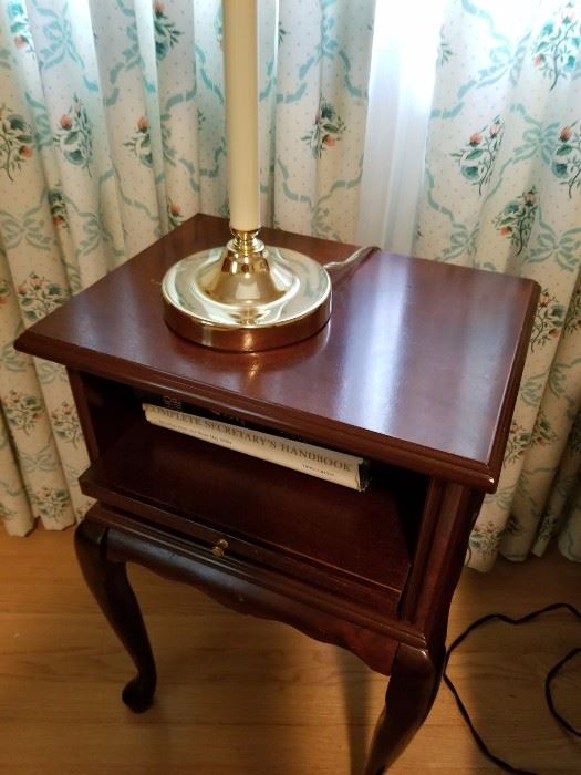 Mahogany side table with pull-out drawer, sitting on cabriole legs. Asking $28.00.