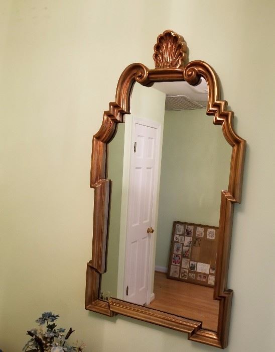 Mirror in elaborate gold leaf frame. Manufacturer unknown. Asking $49.00.