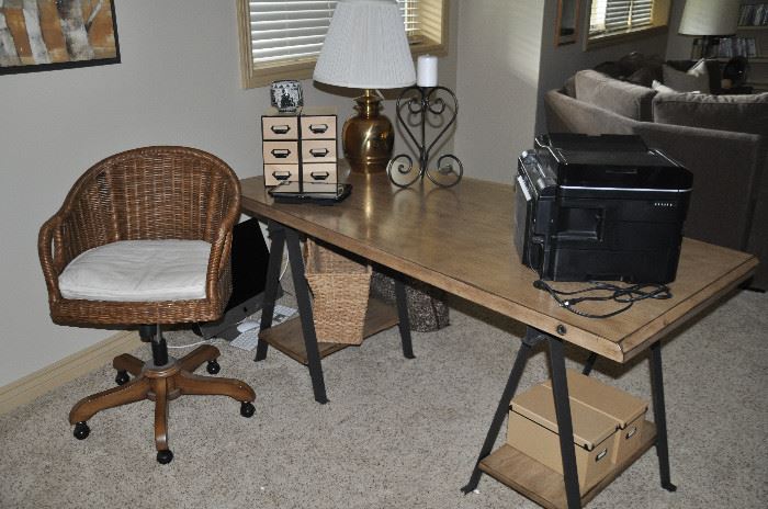 Distressed wood desk with painted steel A frame legs by Ballard Design 65" x 30" x 29". Shown with a Wingate rattan swivel desk chair by Pottery Barn