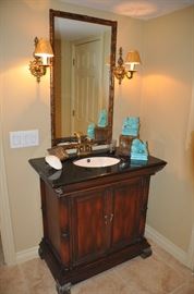 Mahogany stained bathroom vanity with granite top (36"w x 36" x 20"d)for sale as well the 40"h x 22"w marbalized mirror and brass 13" sconces