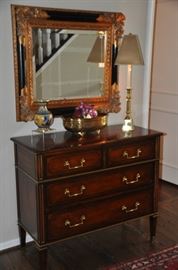 Stunning flamed mahogany 4 drawer chest with brass trim. 40"w x 16"d x 34"h. Shown with gold guilded and black framed beveled mirror 
