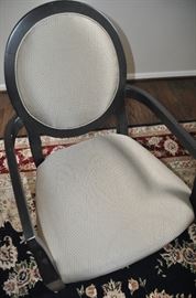 Oversized upholstered painted black shield back arm chairs 26"w x 39"h x 22"d. Upholstered chairs are a deep sage green. 