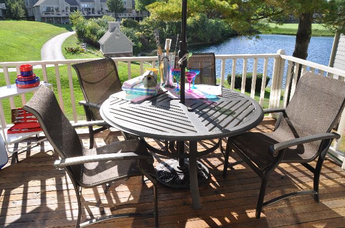 Outdoor 54" dining table and 4 chairs by Winston.  