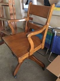 Great old wood rolling office chair 