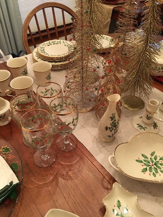 Many pieces of Lenox Holiday China: Dinner Plates, Salad Plates, Mugs, Covered Casserole Dishes, Christmas Tree Dish, Divided Dish, Handled Serving Dishes, Stemware, Candlesticks, Vase, Cream and Sugar and more!  The majority are new with box.