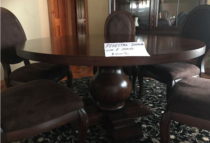 Wood pedestal dining table with 5 padded chairs-$400.