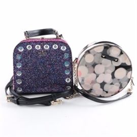 Kate Spade Mini Handbags: A pair of Kate Spade small handbags. The All That Glitters box bag features a multicolored sparkled finish, gold tone frame and black leather handle, along with a detachable shoulder strap. Also included is a smaller round zipper pouch in the patent leather _ Cherry Terrace_ pattern with a black patent leather shoulder strap.