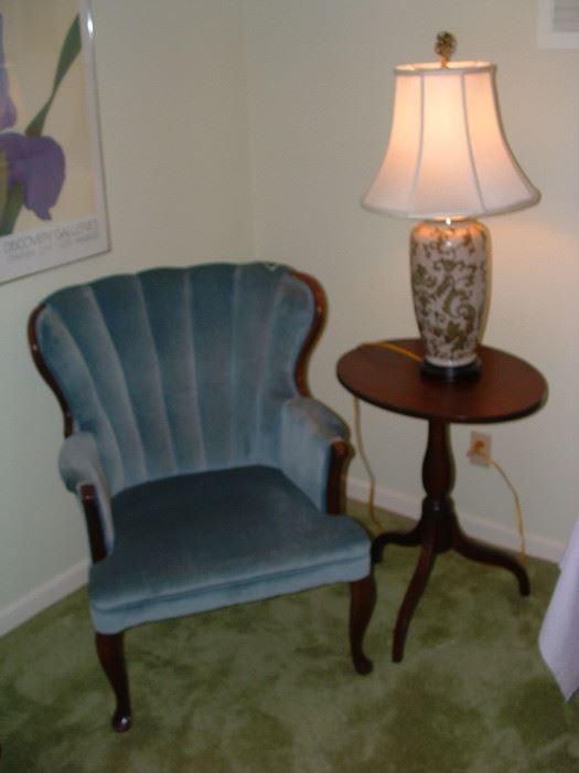 nice upholstered chair and vintage tilt top table