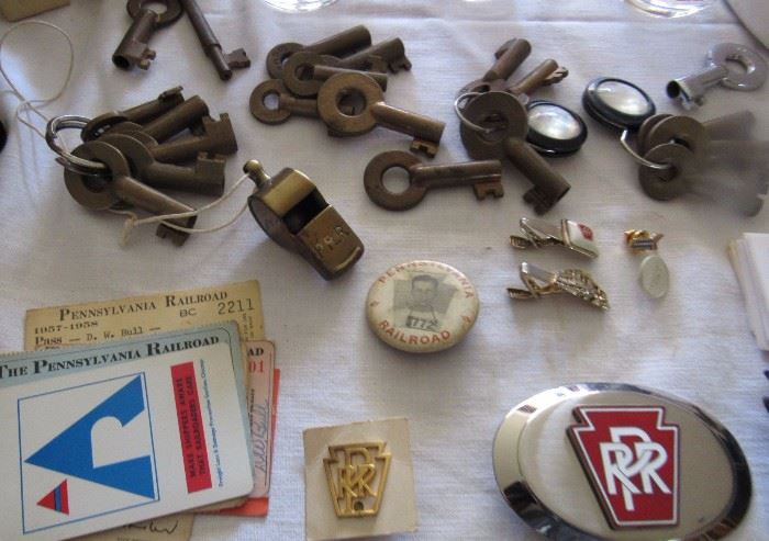 Railroad Keys, tickets, belt buckles, tie clips, many mementos from two generations of Pennsylvania RR employees 