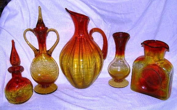 Amberina/Tangerine Collection to include:  Tall Benko Pitcher; Pinch Pitcher with Stopper; Dual Spout Water Bottle; Dual Handle Pitcher with Stopper; Vase