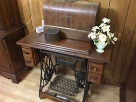 Vintage Singer treadle machine and boxed machine