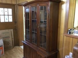 Cherry China cabinet with storage in bottom