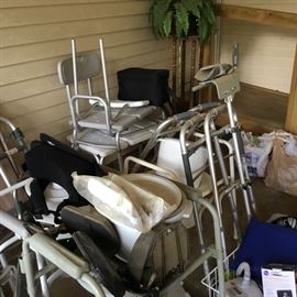 Various medical items including bath benches, walkers, canes, potty chair & more