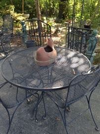 Round table; 4 matching chairs (The table is a different "weave.")