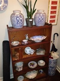 Book shelf, ginger jars, and blue & white umbrella holder