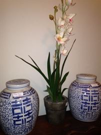 Ginger jars and artificial orchids