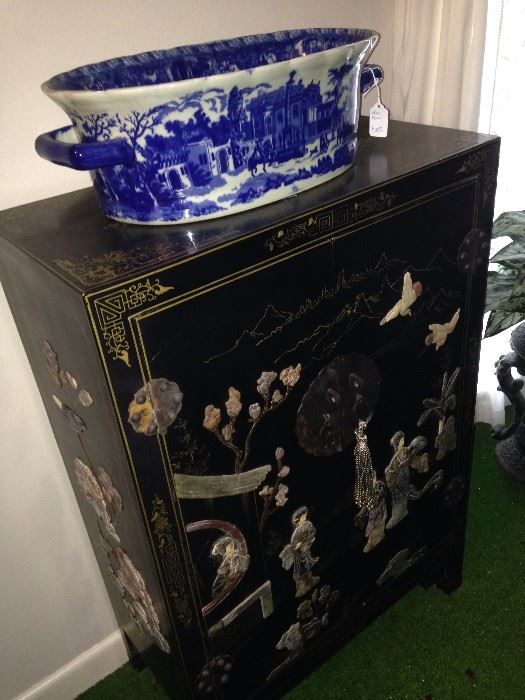 Black Asian 2-door chest featuring soapstone ladies, flowers, and birds; blue & white planter