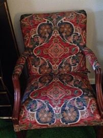 One of two matching upholstered arm chairs