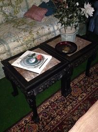 Two carved Asian style tables with marble top inserts