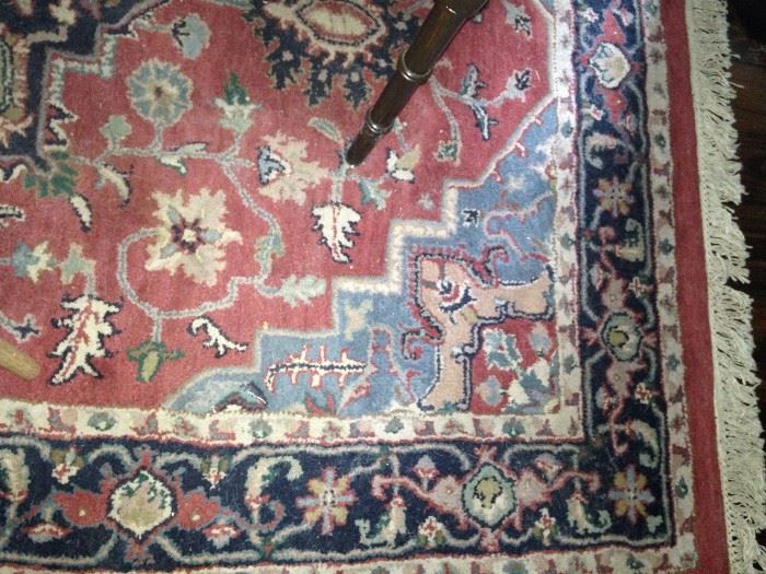 64 inches x 96 inches rug in reds and blues