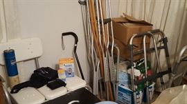 Lots of medical equipment.  New shower chair, metal fold up walkers, adjustable crutches, disposable pillow cases, and diapers. Wheel chair and other items not shown.