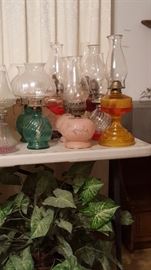 Antique oil lamps and few vintage style oil lamps. 