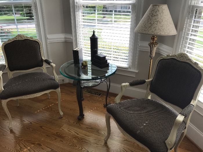 matching chairs, standing lamp, glass top side table and decor