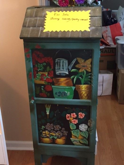 Storage cabinet with flowers. They are not real, they are painted on.