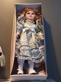 Creepy doll in a box. This should be with the Halloween stuff. 