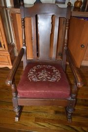Antique rocking chair with needlepoint seat