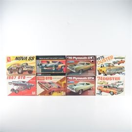 Collection of Muscle Car Model Kits: A collection of muscle car model kits. This collection offers eight kits in either 1/24 or 1/25 scale presented in original boxes. The included models are a Chevy Nova SS Pro Stocker by AMT, a “Mean and Nasty” Pro/Street Camaro, two 1970 Plymouth GTX all by Monogram. There is also a 1967 GTO Pontiac, a 1968 GTO Pontiac Hardtop, a 1974 Duster, and a 1975 Duster all by mpc.