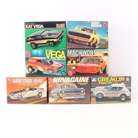 Vintage Model Funny Car Kits featuring AMT: A collection of vintage model Funny Car kits. This collection offers seven kits including a Rat Vega by Monogram, a Chevrolet Vega Van Funny Car, Camaro Funny Hugger, Mustang Funny Car, Dodge Challenger Funny Car, Chevy Nova Funny Car, and a Gremlin Funny Car all by AMT.All kits are presented in original boxes in a 1/24 scale.
