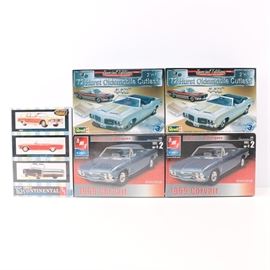 Vintage AMT and Revell Model Kits: A grouping of vintage model car kits. This grouping offers five kits including two factory sealed 1969 Corvairs by AMT, two factory sealed 1972 Hurst Oldsmobile Cutlass by Revell, and a 1965 Lincoln Continental by AMT “Nostalgic Series”. All kits are in the 1/25 scale and presented in original boxes.