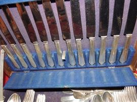 this art deco style solid sterling silver 61 pc set includes 12 knives, 12 long forks, 12 short forks, 11 teaspoons (1 is missing) 12 petite spoons, 1 sugar spoon, 1 butter knife. BUY IT NOW $1,500.00 ALL OFFERS CONSIDERED.