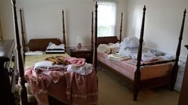 Pair of four-poster beds with canopies twin size