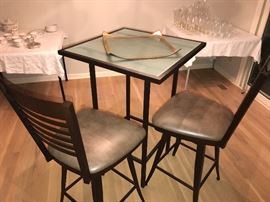 Bistro style glass top table and two chairs