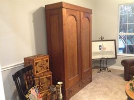 Large Victorian-era armoire with wooden Texas star trunks. Matching leather sofa and armchair, coffee table and numerous chairs. Staging furniture and estate items.