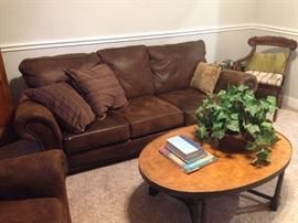 Large matching leather sofa and reclining armchair. Antique chair with coffee table and books. Staging furniture and estate items.