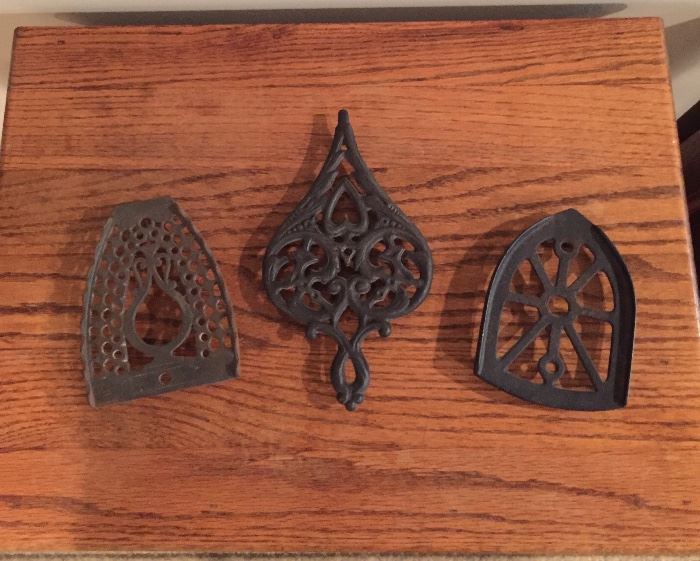 Iron trivet and two vintage iron rests