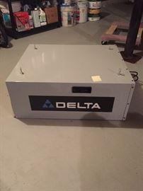 Delta air filtration system for woodworking area. Has remote and extra filters.