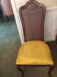 One of 8 cane chairs