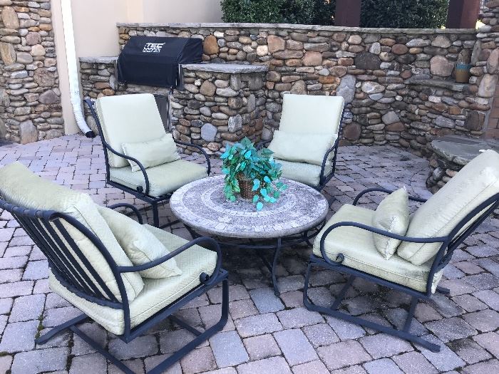 There are several outdoor living pieces ~ set of 4 metal bouncey chairs & a mosaic coffee table