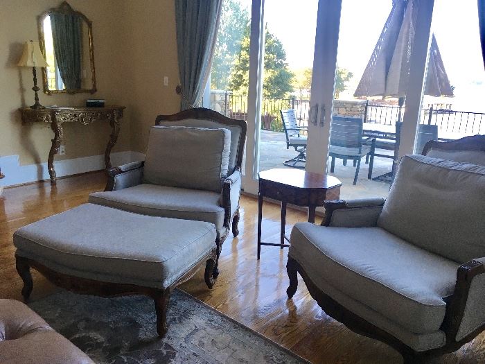  Pair of oversized armchairs, each has an ottoman