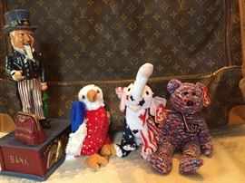 Vintage bank and political Beanies, cuddling up to Louis Vuitton luggage. (Can't blame them)