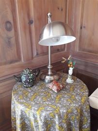 Lighted teapot, vase, tablecloth, hide-a table, scented coasters, reading lamp.