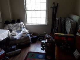 Electronics, men's hats and clothing, tools, twin bed frame, collectibles, blankets, rug, loveseat, leather chair, twin roll away bed frame, twin roll away bed collectible trains, Christmas items, Oil City, PA blanket,tools, office supplies.